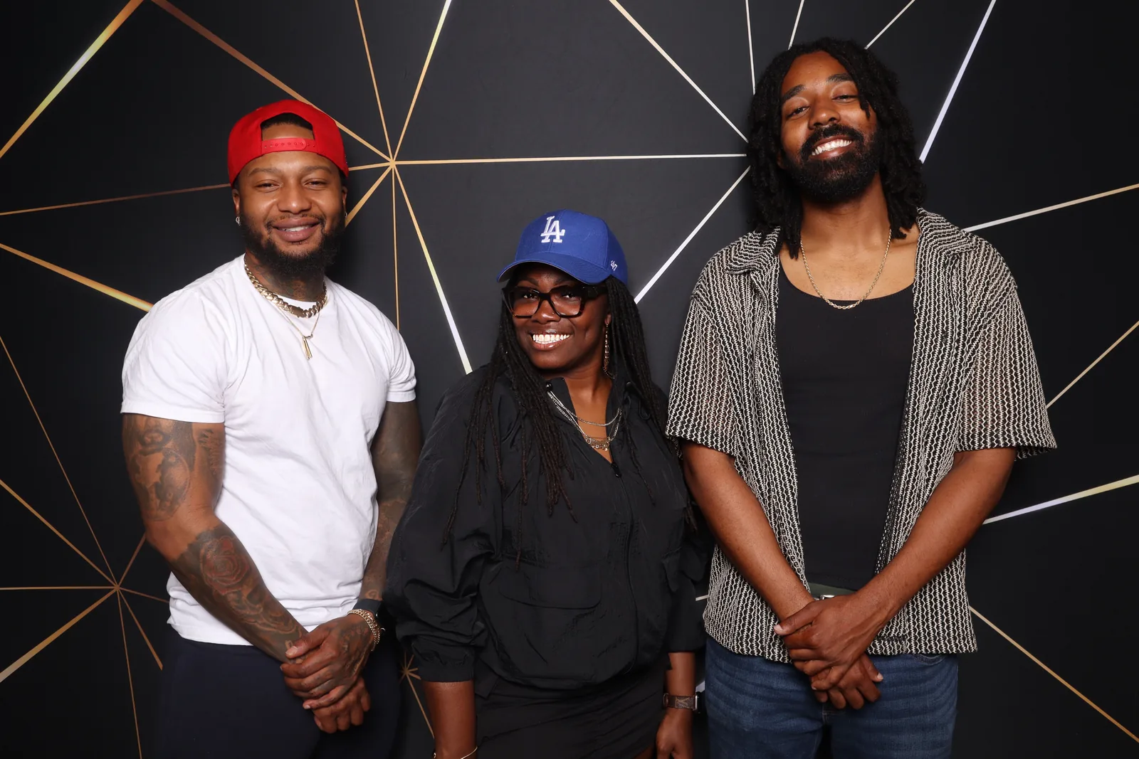 Corporate event photo booth with black and gold geometric backdrop — Portsmouth, Virginia