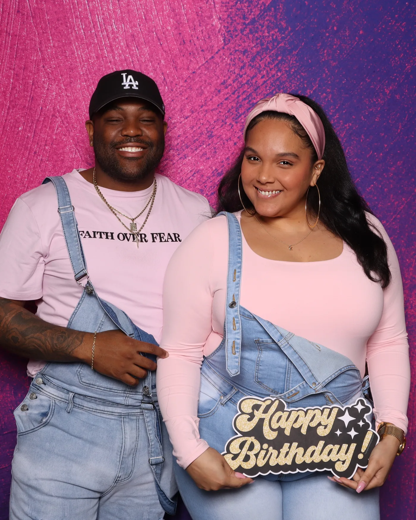 Couple celebrating a birthday at a pink glitter photo booth — Virginia Beach